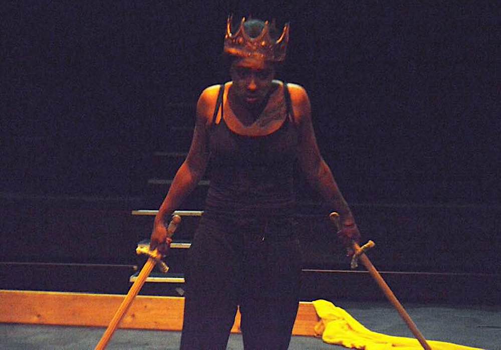 Actor in crown with swords