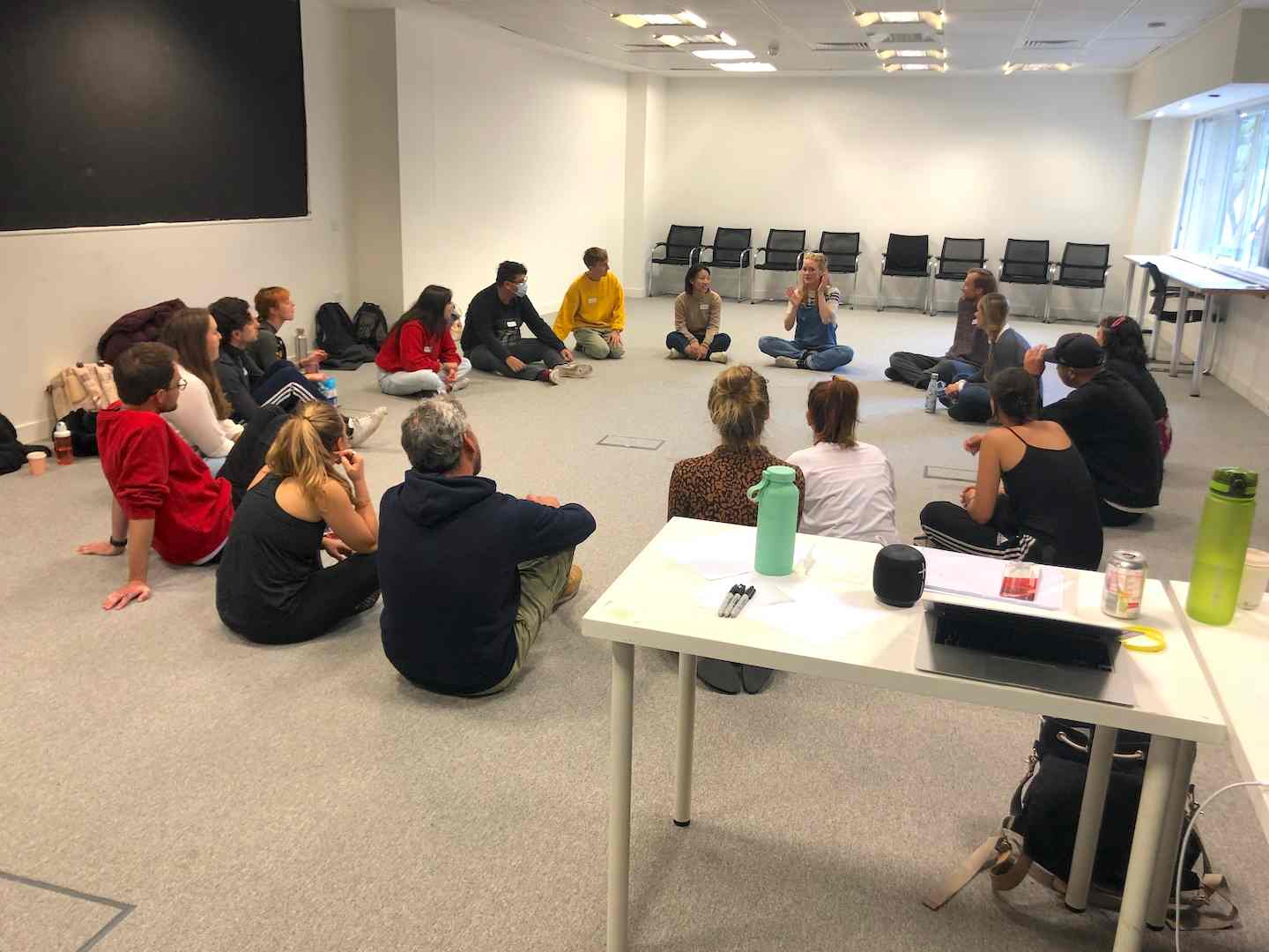 Students sitting in a circle in a classroom